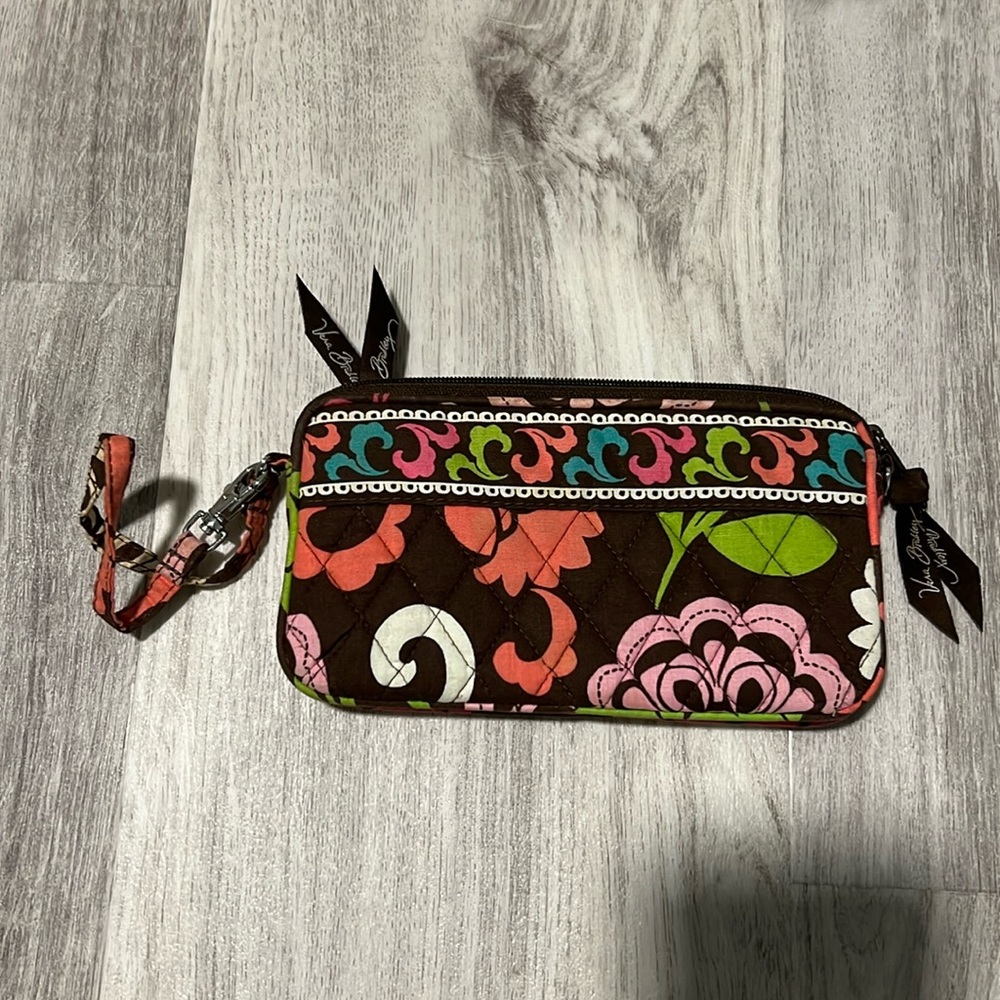 Vera Bradley pocket book with a wrist band.
